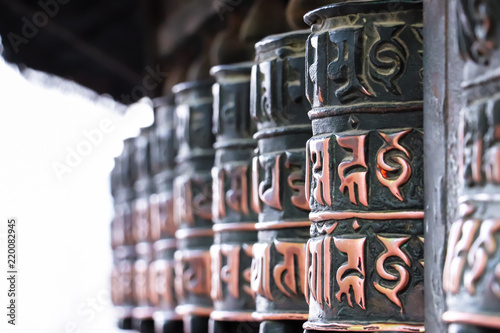 Circular Prayer wheels with Buddhist manuscripts encarved