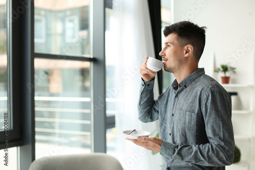 Businessman drinking coffee...