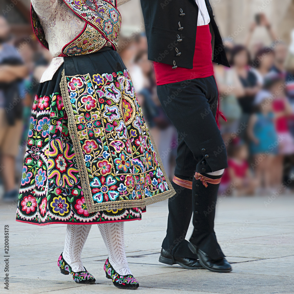 Man and woman dancing and wearing the traditional folk costume from Zamora (Spain)
