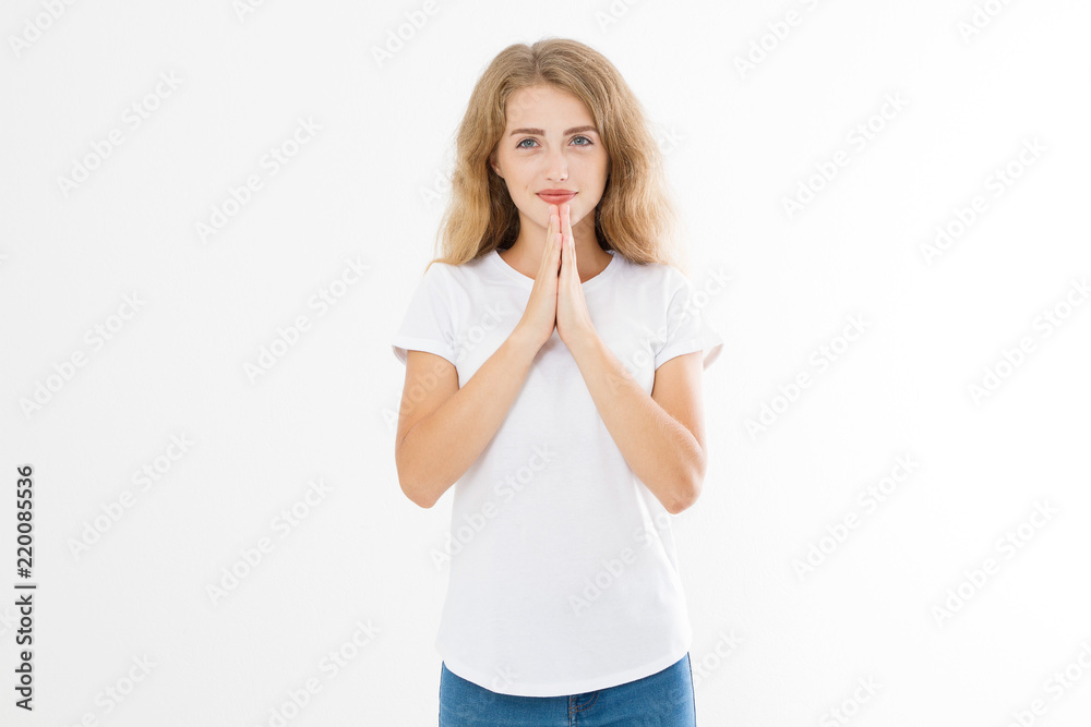 Religion concept. Praying young caucasian girl. woman in summer shirt isolated on white background. Copy space. Mock up. Make a wish Religion concept. Praying young caucasian girl. woman in summer shirt isolated on white background. Copy space. Mock up. Make a wish