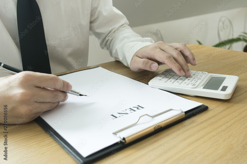 The young man is waiting for a house loan from a financial expert who checks his property. The young man is waiting for a house loan from a financial expert who checks his property.