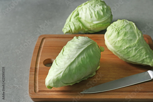 Fresh pointed cabbage on wooden board