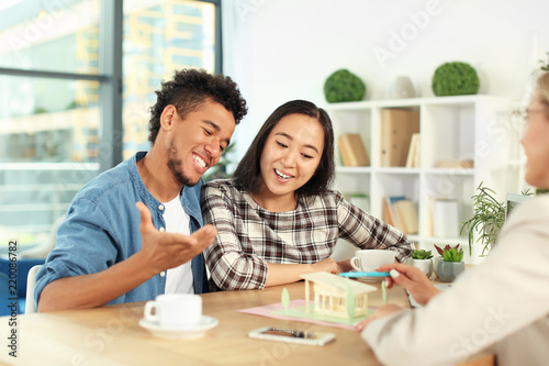 Real estate agent showing m...
