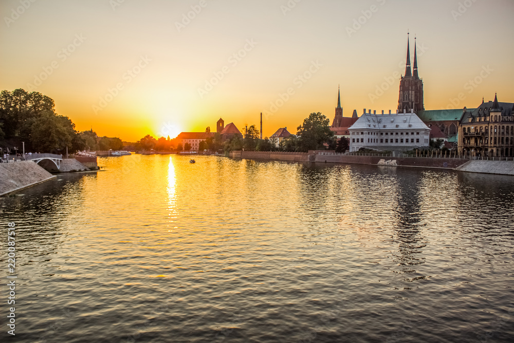 river waterfront old medieval city street in shoreline district in summer colorful evening sunset time