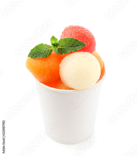 Cup with fresh melon and watermelon balls on white background