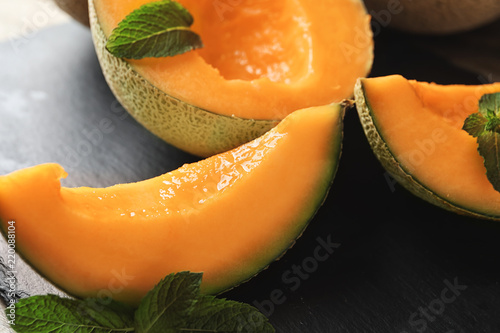 Tasty cut melon on table, closeup
