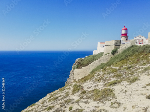 Lighthouse over cliff in Sagres, Portugal. © Joaquin Corbalan