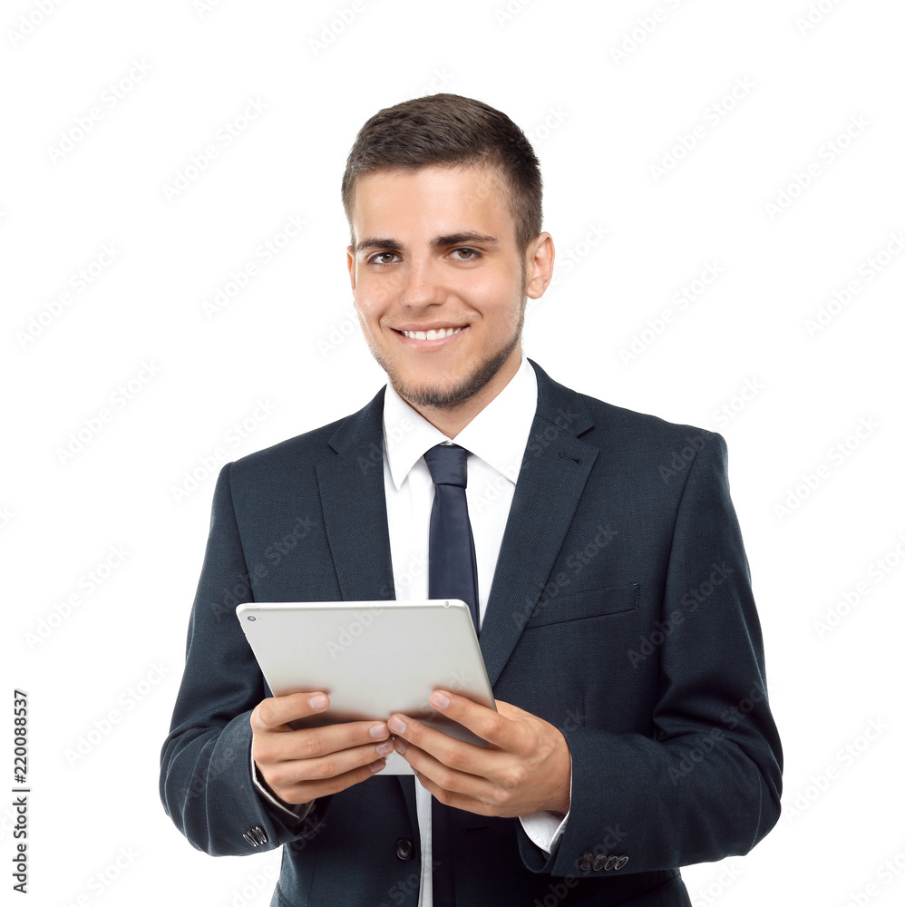 Handsome young man in stylish suit holding tablet PC on white background Handsome young man in stylish suit holding tablet PC on white background
