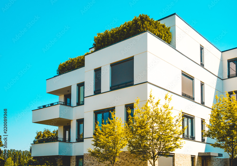 beautiful apartment building with green tree - obrazy, fototapety, plakaty 