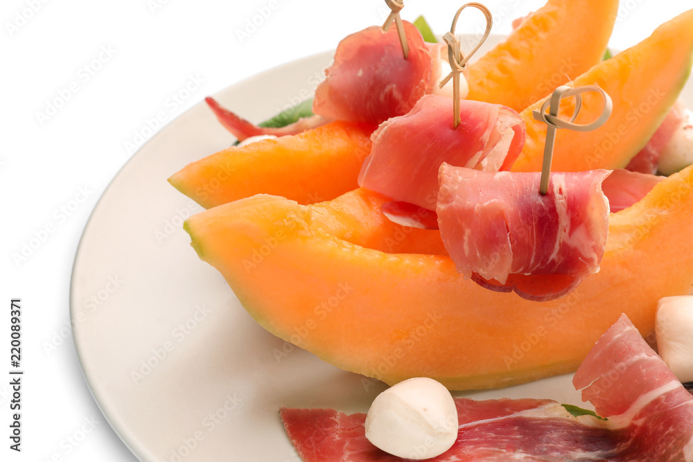 Delicious melon with prosciutto and mozzarella cheese on plate, closeup Delicious melon with prosciutto and mozzarella cheese on plate, closeup