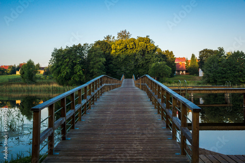 Bridge on the Wydminskie lake in Wydminy, Masuria, Poland photo