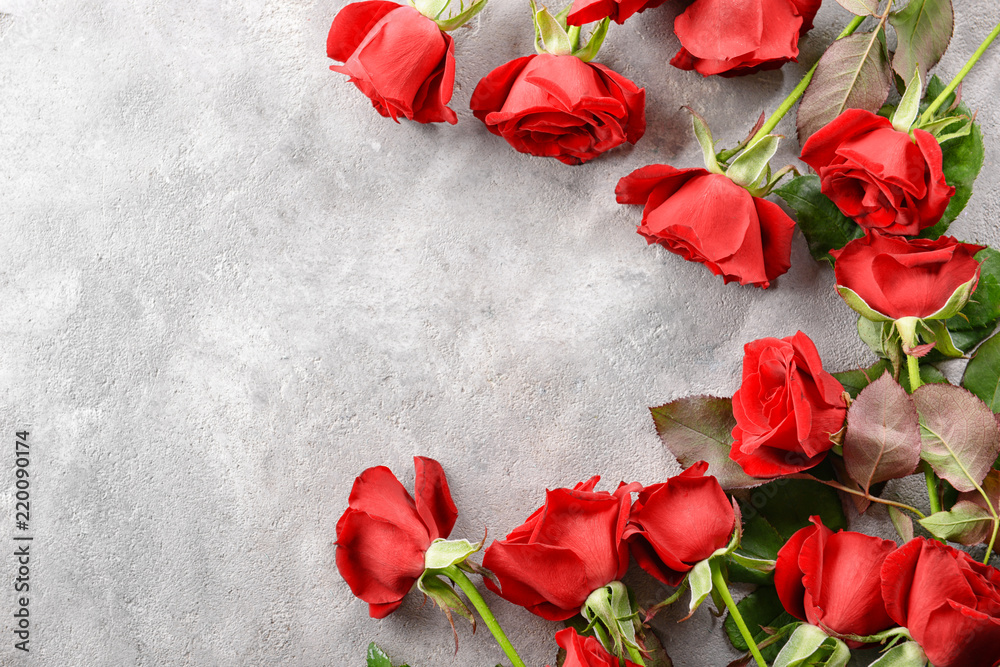 Beautiful red roses on grey background Beautiful red roses on grey background