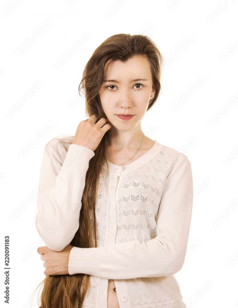 Emotions of a beautiful girl with long hair, in a white jacket posing in Studio on a white background. Emotions of a beautiful girl with long hair, in a white jacket posing in Studio on a white background.
