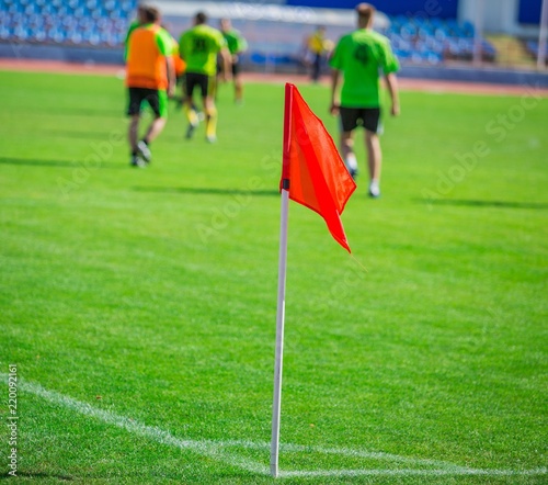 Football Corner Flag With Football Players In Background