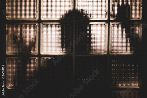 Quadro em tela Silhouette of shadow like man shape behind the mirror