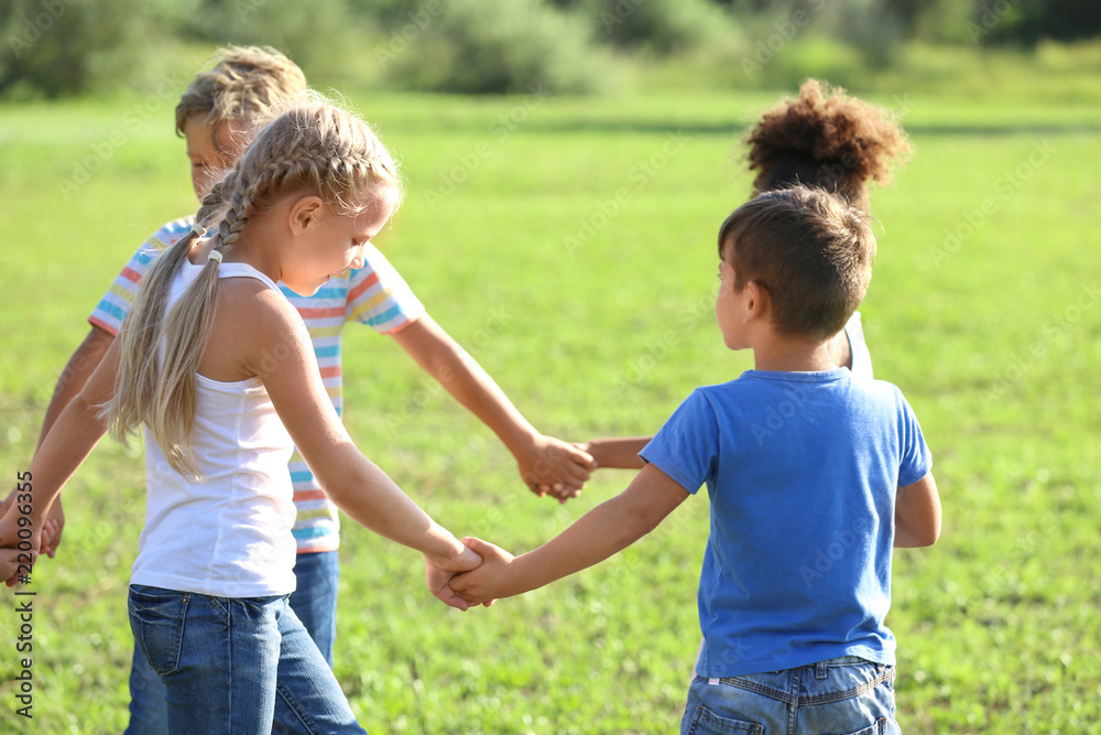 Fototapeta premium Cute little children playing outdoors