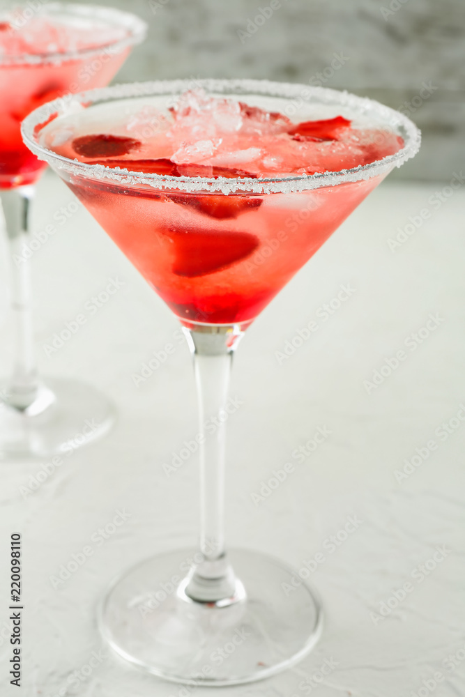 Fresh summer cocktail in glass on light table Fresh summer cocktail in glass on light table