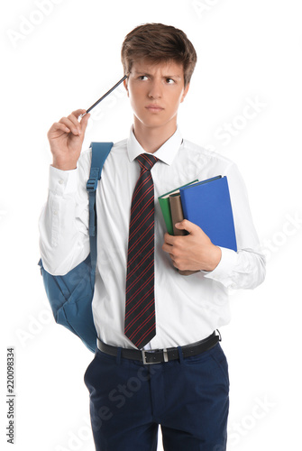 Thoughtful teenage boy with...