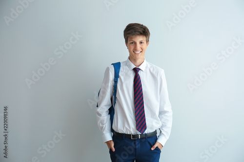 Teenage boy with backpack o...