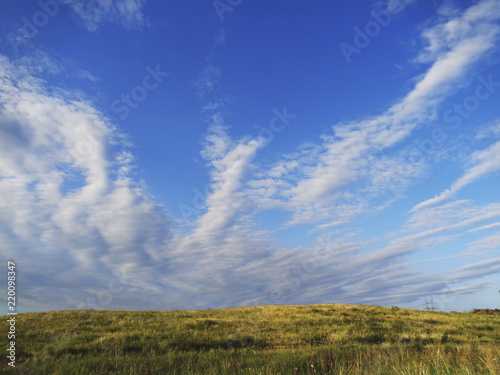 Blue sky and meadow. Summer background. Nature background.