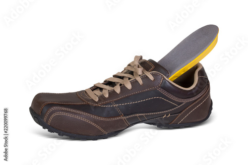 Attractive brown men leather shoes with light brown laces and shoe insole come out of the shoe. Perfect option to fit your shoes with insole. 