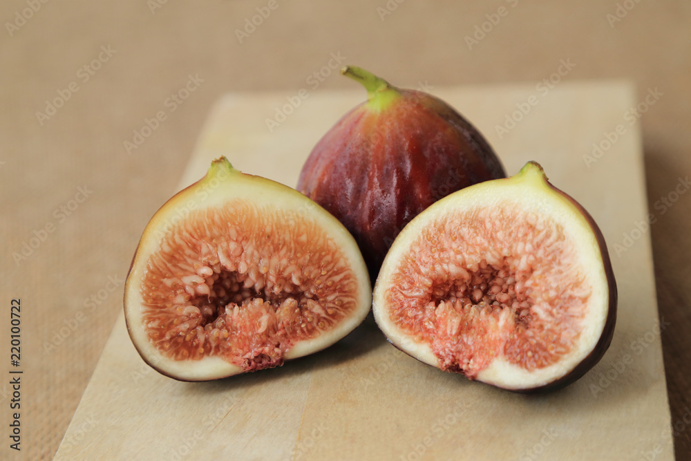Fresh fruits, figs (Ficus carica) on the wooden plate. Fresh fruits, figs (Ficus carica) on the wooden plate.