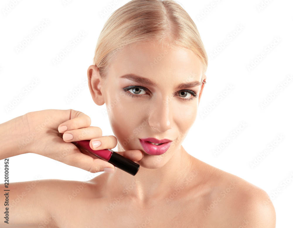 Beautiful young woman with bright pink lipstick on white background Beautiful young woman with bright pink lipstick on white background