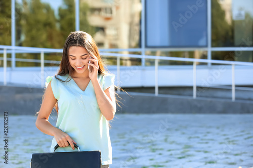 Young businesswoman talking...