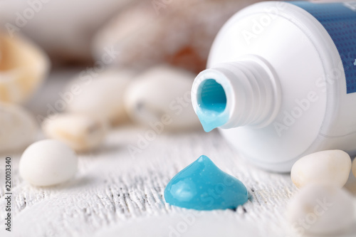 Sea minerals and toothpaste on blurred background