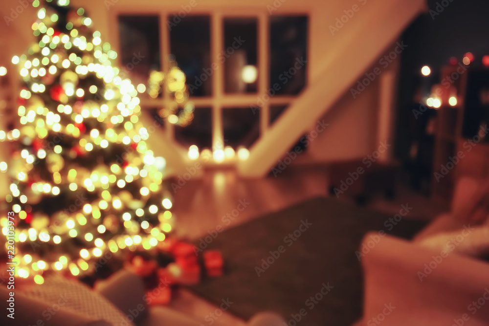 Blurred view of room with beautiful Christmas tree