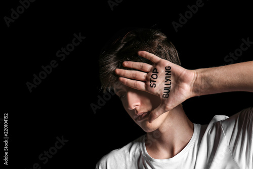 Teenage boy with text STOP ...