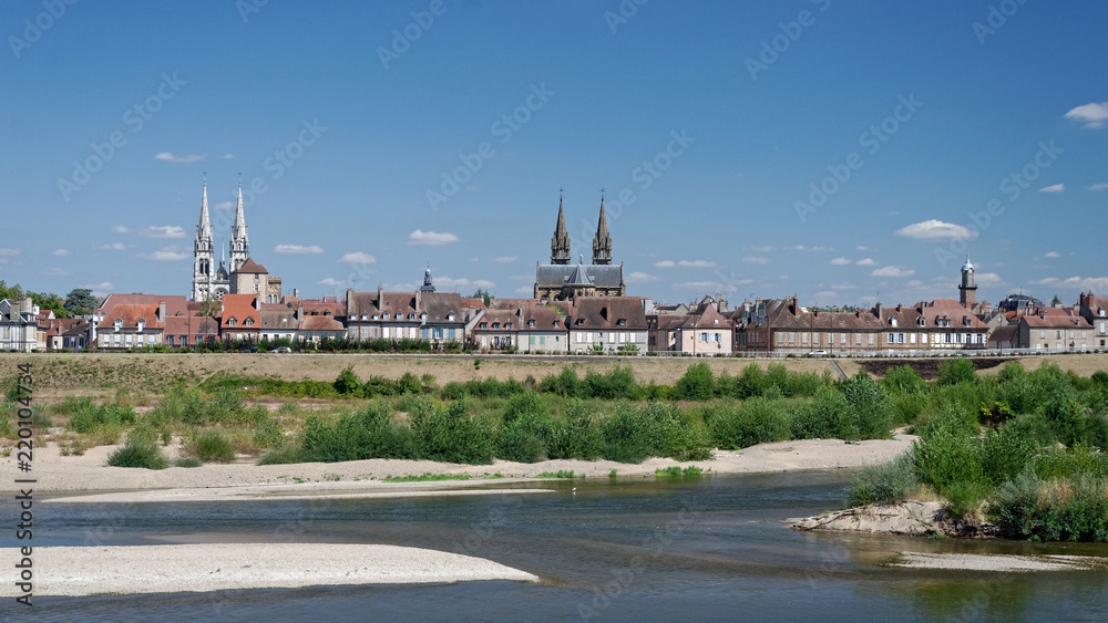 Panoramic view of a french town by a riverside