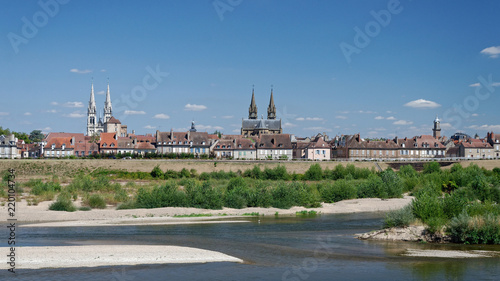 Panoramic view of a french town by a riverside