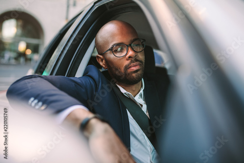 Businessman driving a car in city © Jacob Lund