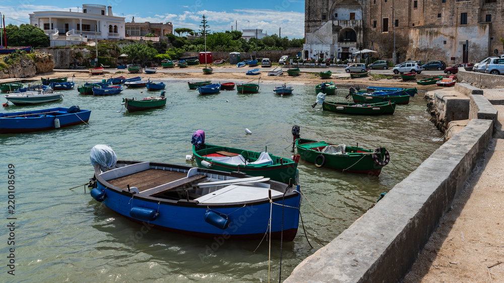 Enchanted sea. Boats in the bay of the abbey of San Vito