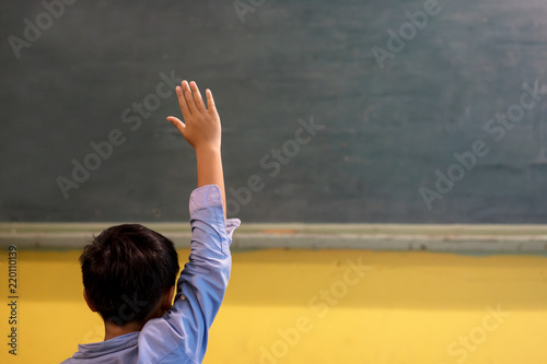 A School kid in classroom at lesson
