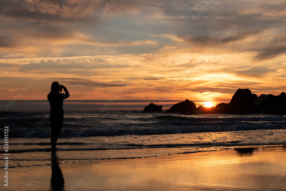 Photographing sunset on the beach