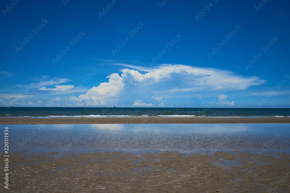 seascape with blue sky and cloud with sand texture