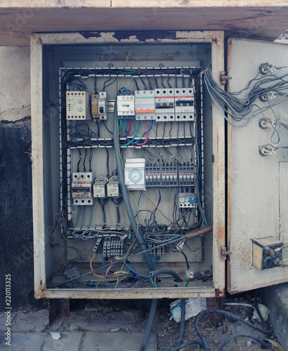 An old open electrical control panel box