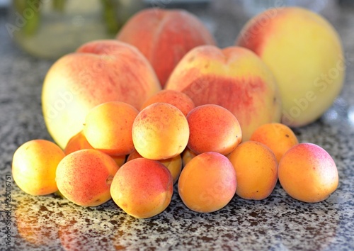 Ripe juicy apricots and peaches, summer harvest