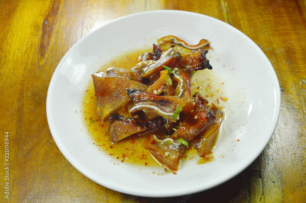 roasted pork ear slice dressing spicy sauce on plate roasted pork ear slice dressing spicy sauce on plate