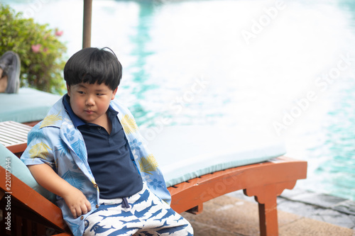 boy waiting to play in swimming pool