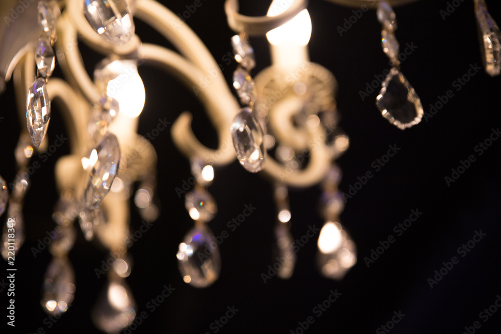 Chrystal chandelier close-up in the dark. Glamour background Chrystal chandelier close-up in the dark. Glamour background