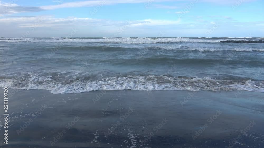 Waves rolling on the beach is a stormy day, winter mediterranean sea. Focene, Lazio, Italy. 4k Waves rolling on the beach is a stormy day, winter mediterranean sea. Focene, Lazio, Italy. 4k