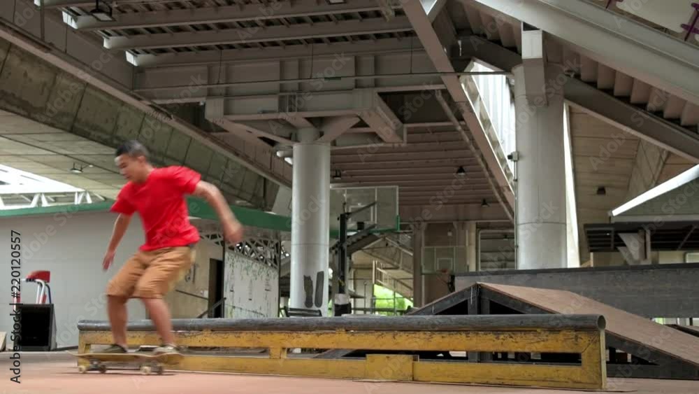 Amature Skateboarder in action in slow motion. Young asian local skateboarder practicing his trick. Urban lifestyle sport concept.