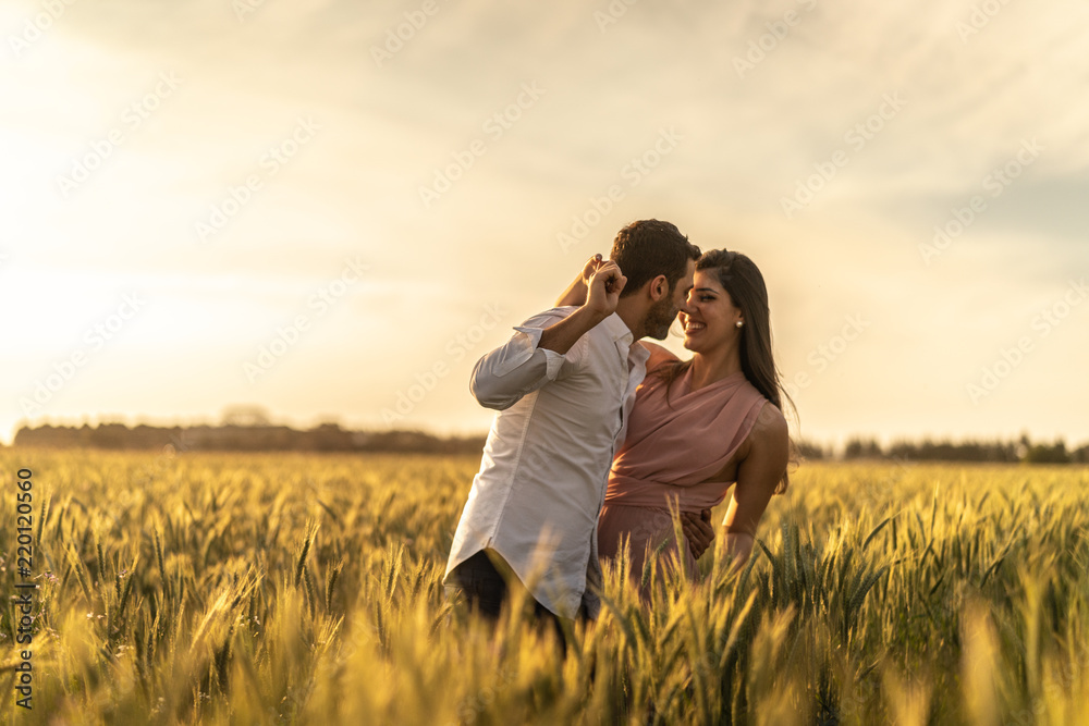 Romantic Couple Exploring at gold wheat field Romantic Couple Exploring at gold wheat field