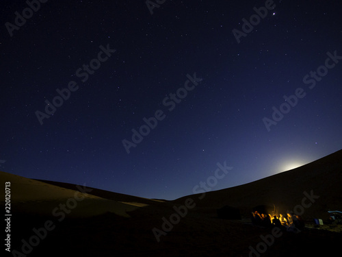 Obraz na płótnie People camping under starry night in Sahara Desert w salonie