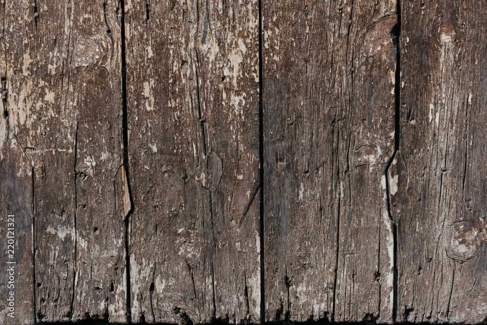 A few grungy old ancient wooden planks in Spain. Wooden dark brown texture