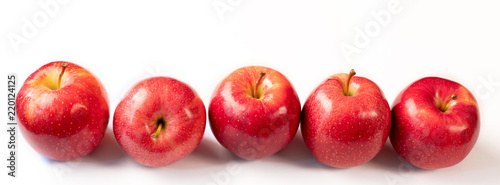 red ripe apples on a white background