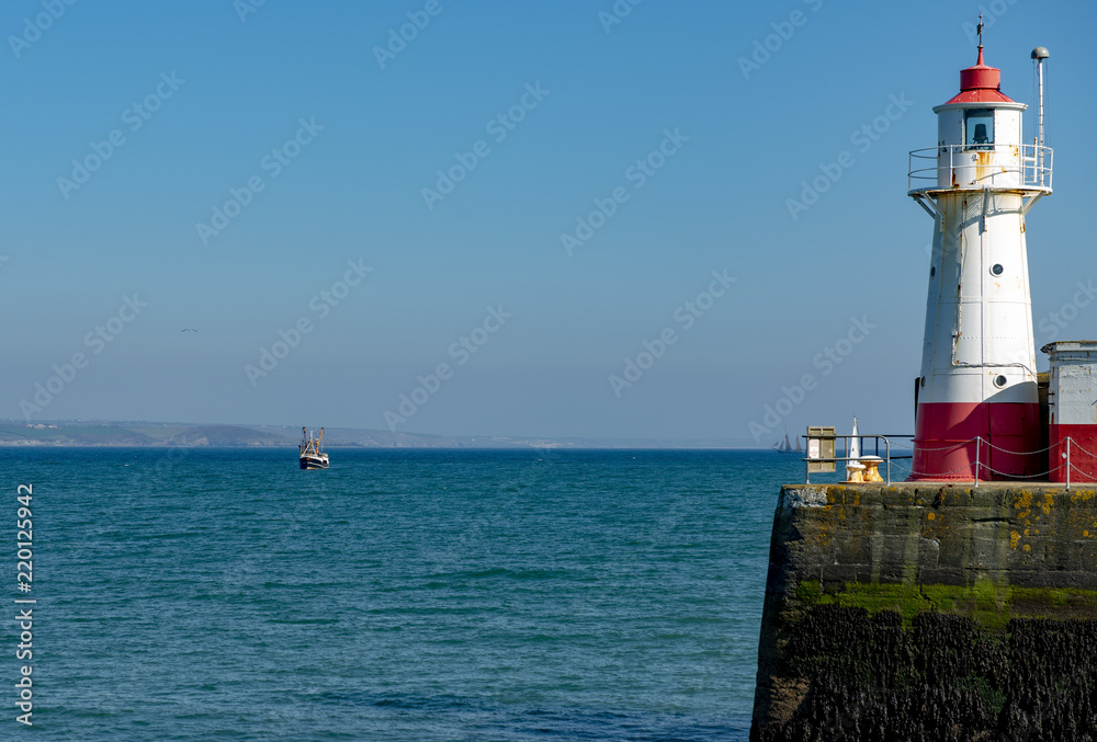 Fishing boat approaching Newlyn Harbour Cornwall